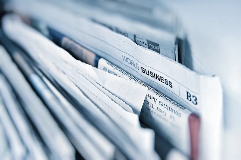 Newspapers with business headlines
