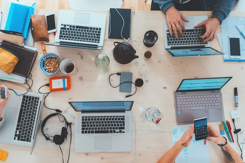People working with laptops and documents